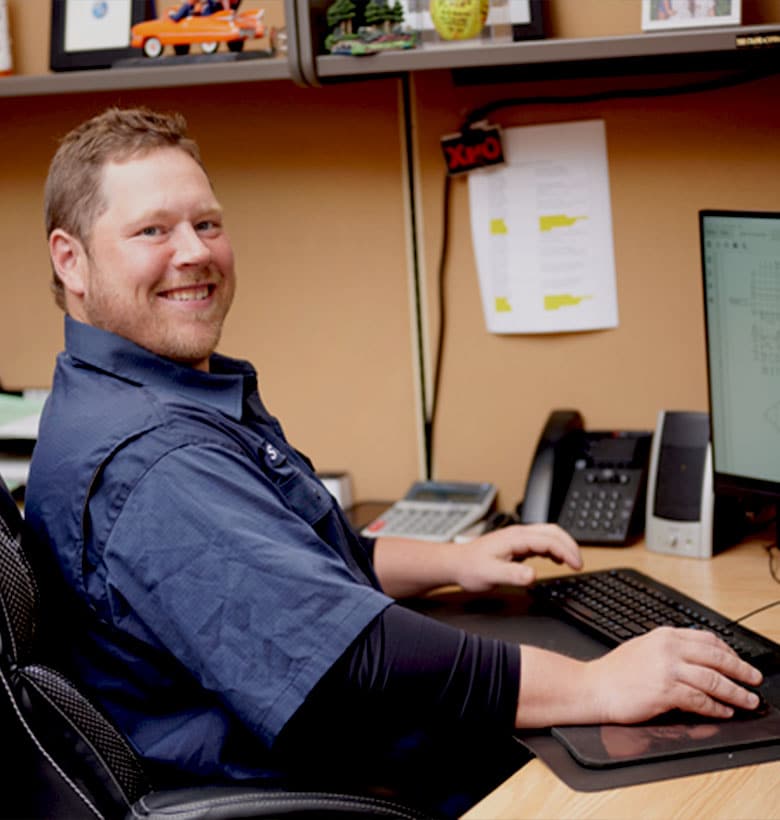 a person sitting in front of a computer