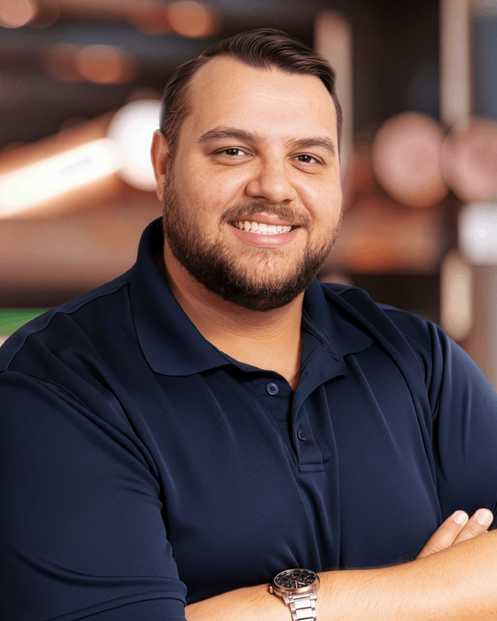 a man in glasses looking at the camera